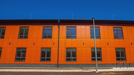 exterior of building painted with orange color at daytime