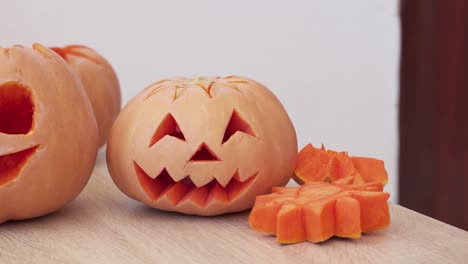 jack o lanterns carved from pumpkins on table