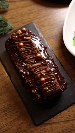 chocolate log cake with gold decorations