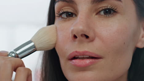 pov morning girl makeup routine indoors. portrait woman applying powder alone