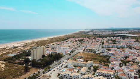 aerial view of altura town in south coast of portugal - drone descend