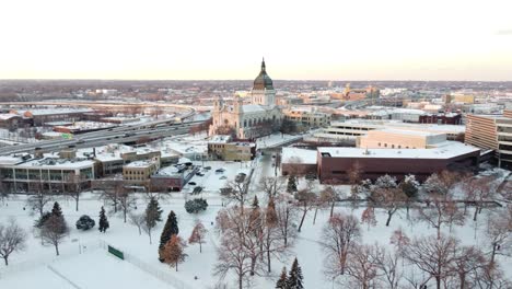 drone approaching church from loring park in minneapolis, mn in winter