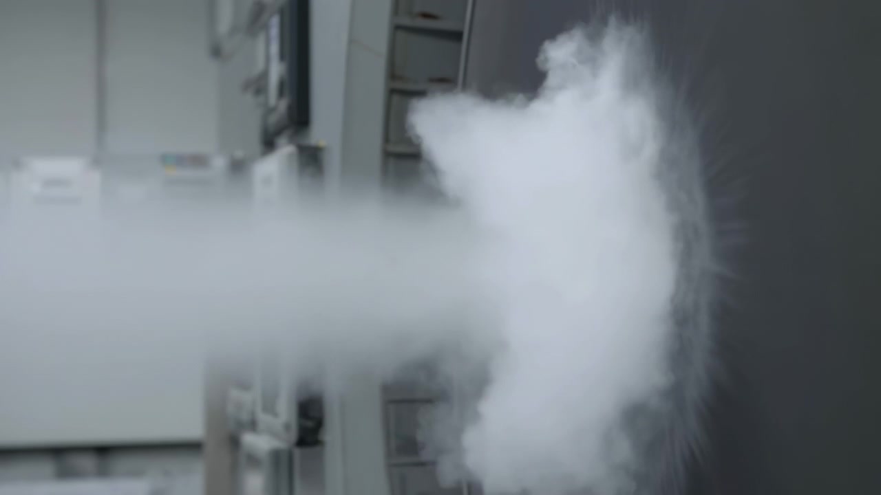 Industrial gas plume ejection from punctured metal panel in equipment room mid sequence