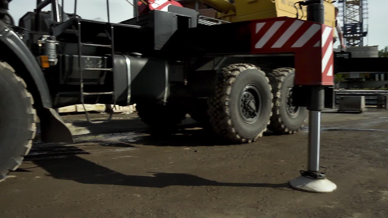 Orange Heavy Duty Truck Crane on Construction Site