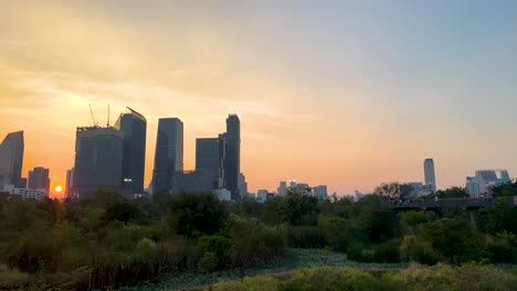 sunset view with city skyline and park