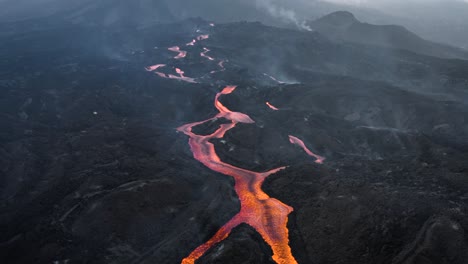 drone flying backwards and revealing cumbre vieja's lava streams