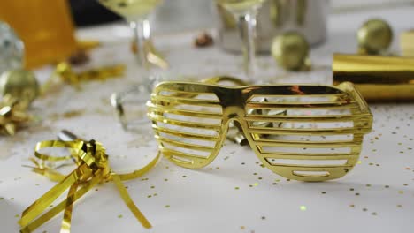 champagne glasses and decorations on white background at new year's eve