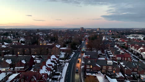 Beautiful-drone-shot-of-sun-setting-over-town-in-Newcastle-after-december-snow