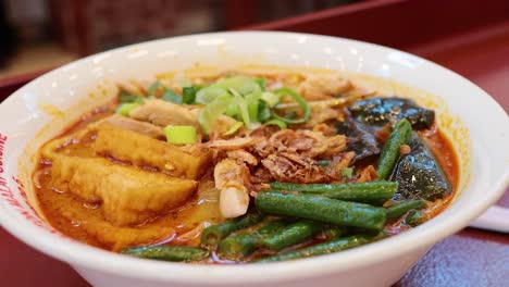 noodle soup with vegetables and tofu at market