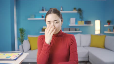 asian paranoid woman afraid of camera.