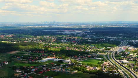 Beautiful-top-side-view-to-the-cars-driving-on-highway-on-the-sunny-evening-in-Warsaw-city