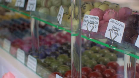 Fancy-chocolates-on-display-through-window-of-retail-shop-UK