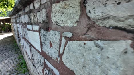 old stone wall and cobblestone path