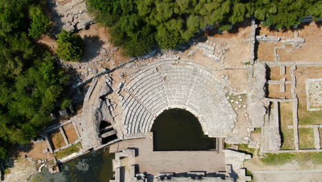 shot drone cenital butrint roman amphitheater and ruins in albania