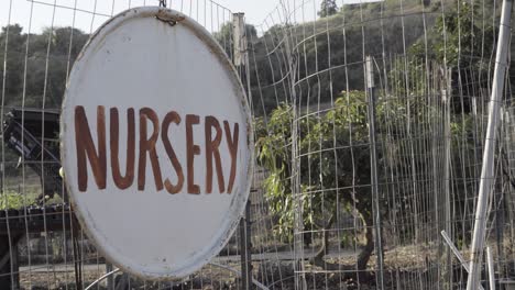 A-sign-that-reads-nursery-and-white-board-map-and-todo-list-at-a-sustainable-permaculture-farm-and-ranch-California