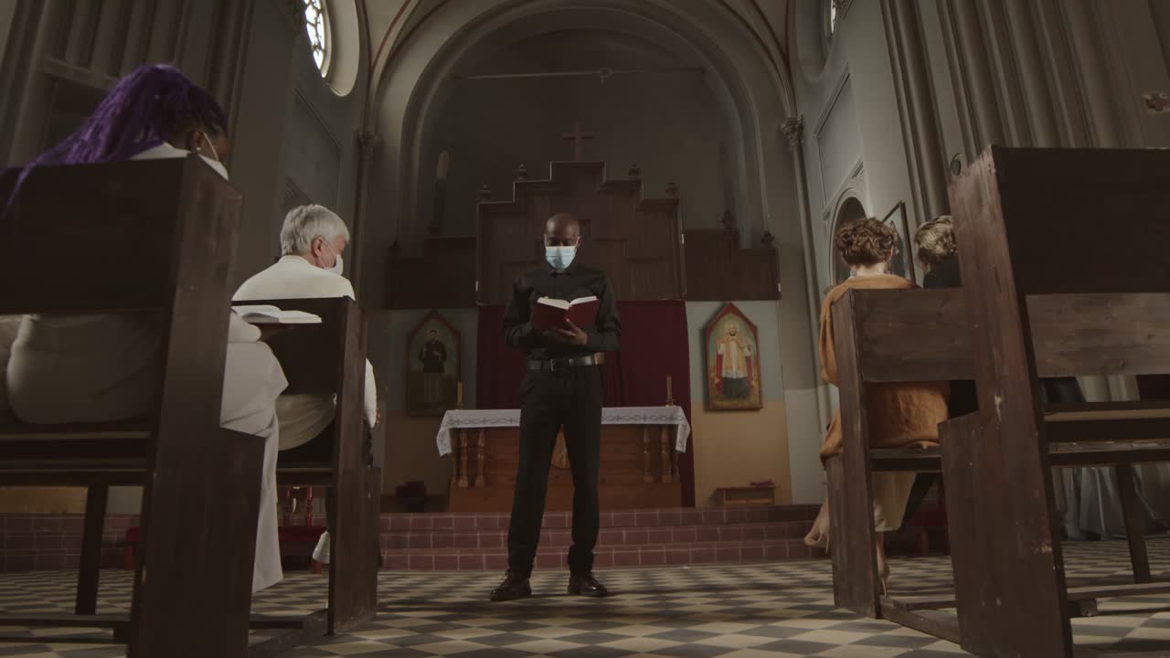 Priest Wearing Mask Preaching Sermon in Christian Church
