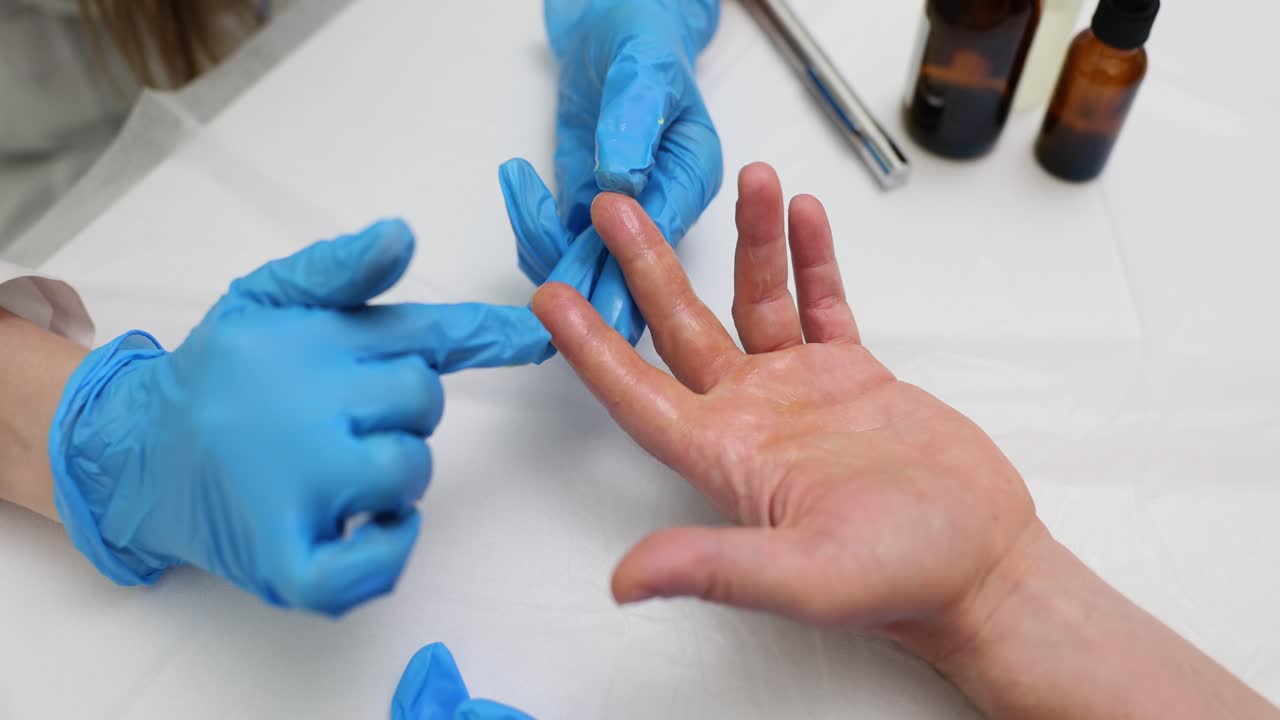 Hand massage with blue gloves