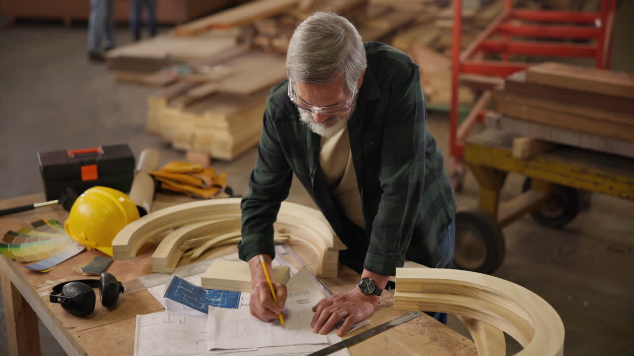 A carpenter working on a project in a workshop