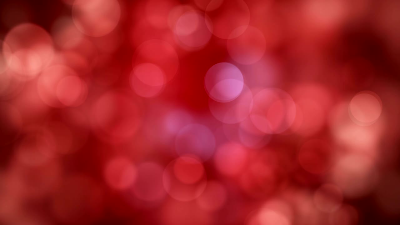 luces brillantes rojas en movimiento, reflejos de luz desfocados fondo bokeh en bucle
