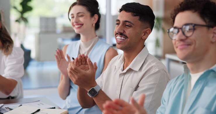 Diverse Group of Professionals Applauding During a Meeting