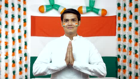 indian man join hands for the greeting (namaste position) facing towards the camera - independence day