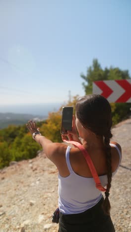 woman hiking on a mountain road