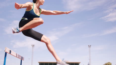 woman practicing hurdle race