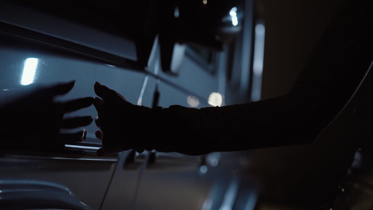 A woman stands in strong backlight at night, creating a soft silhouette and lens flare for a dramatic cinematic look. Concept for fashion film aesthetics, mystery, and modern nightlife visuals