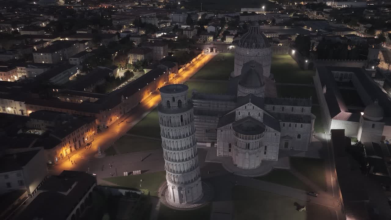 Cinematic sunrise drone footage of the Leaning Tower of Pisa and the Piazza dei Miracoli, captured with smooth aerial movements and soft early morning light