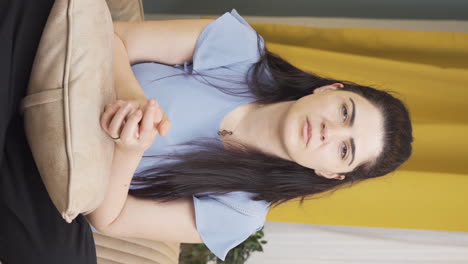 Vertical-video-of-Woman-looking-negative-at-camera.