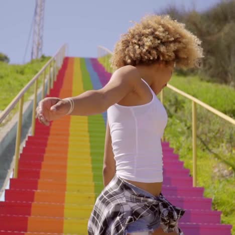 young woman dancing on the stairs