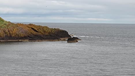 speeding towards the dunnottar castle, scotland, united kingdom