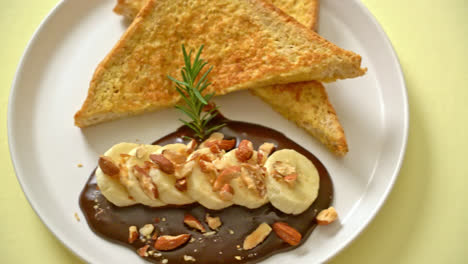 french toast with banana chocolate and almonds for breakfast