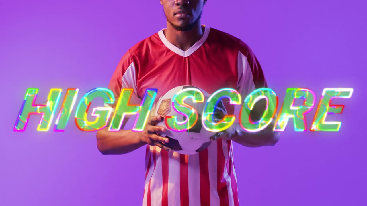 Soccer player holding ball with High Score text animation over purple background