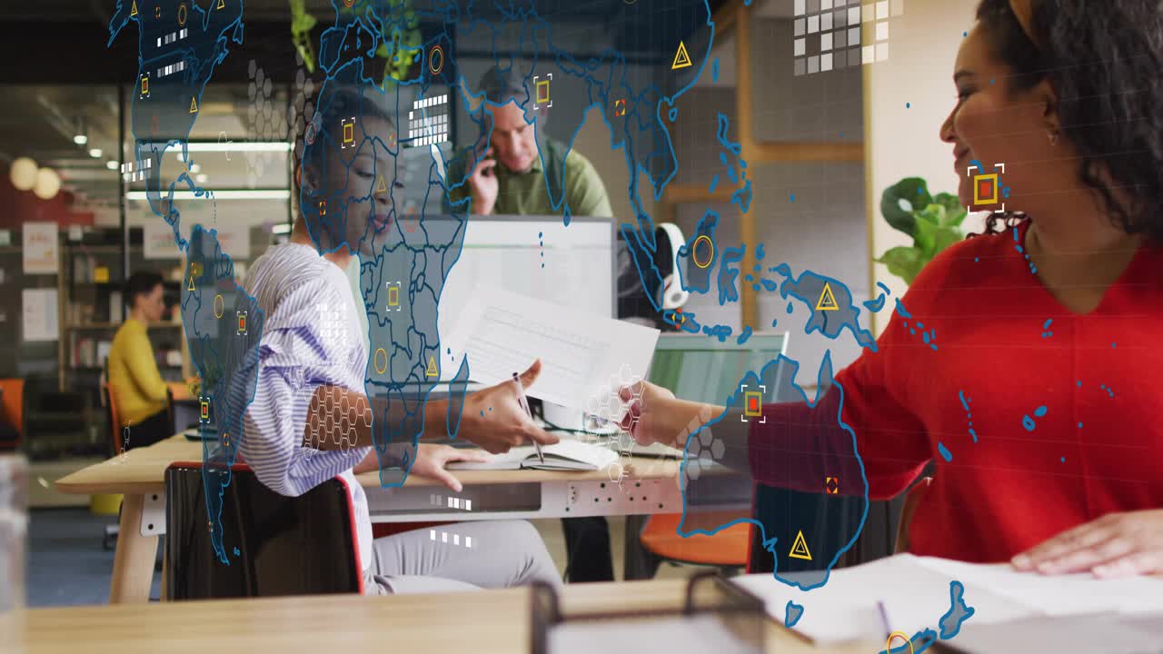 Woman handing document, peer reviewing laptop while business map overlay animating over colleagues