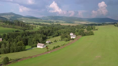 drone shot of summer countryside with meadows and fields in czech republic