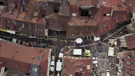 tourists on busy streets of annecy, france - european travel desitnation, aerial drone top down view