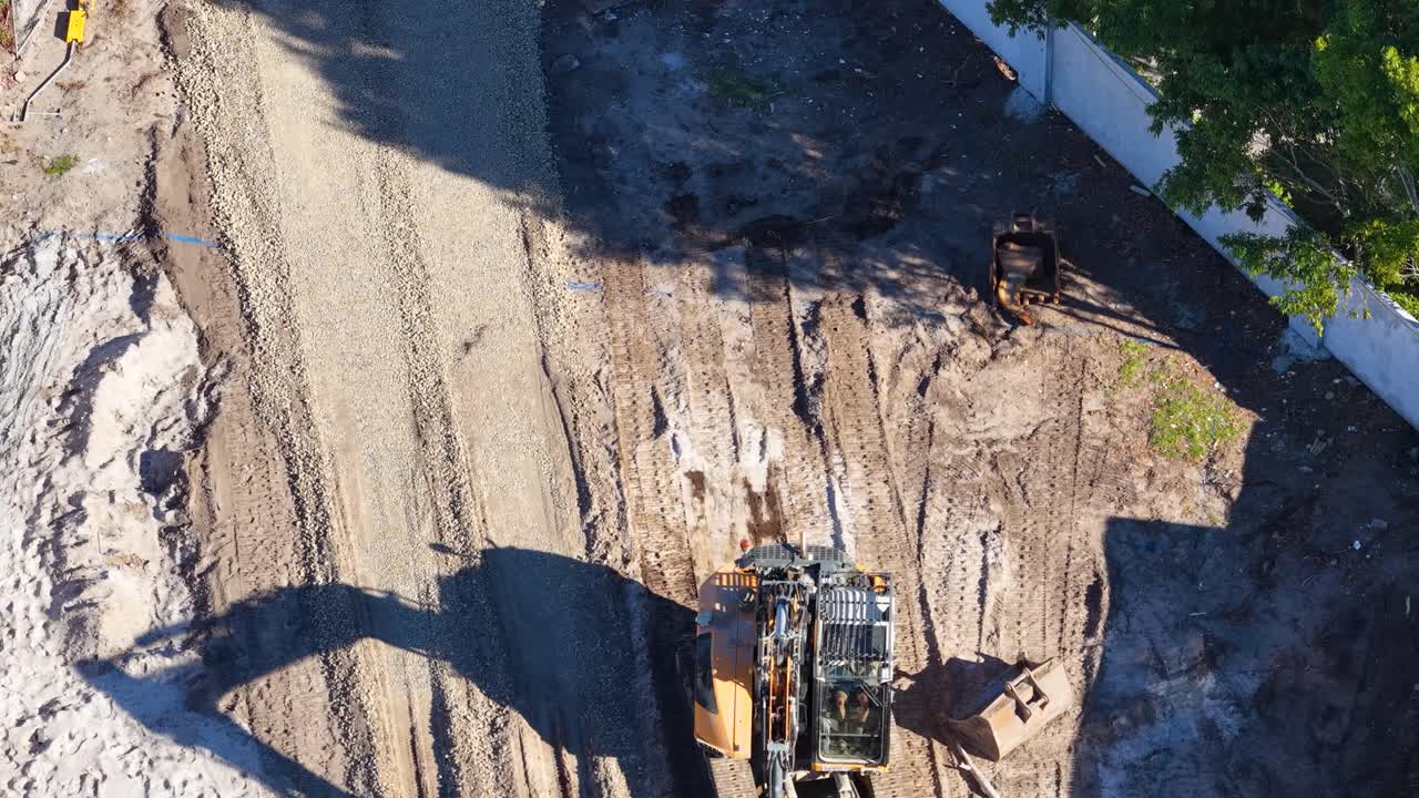 Construction Site with Excavator and Gravel