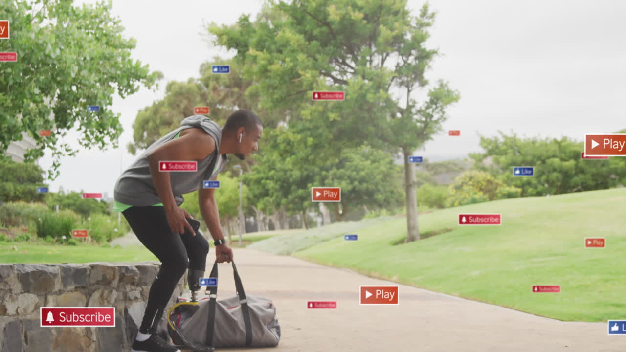 Animation of notification icons over african american male athlete with prosthetic leg in park
