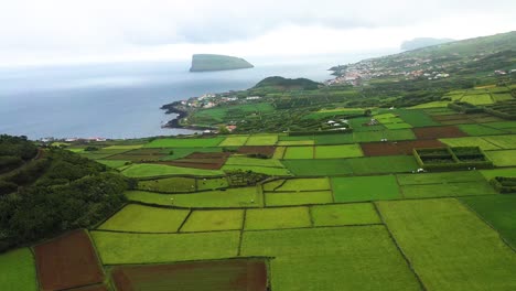 Aerial-View-Of-Terceira-Island-Fields-Overlooking-The-Cabras-Islets-In-Azores,-Portugal