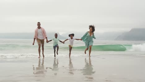 family enjoying free time by the sea