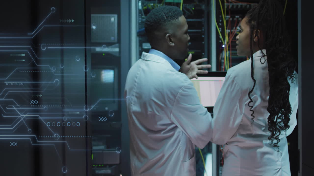 Animation of data processing and african american it technicians with laptop by computer servers