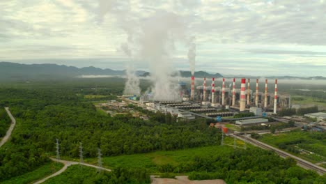 beautiful landscape coal power plant in the morning time with fog.