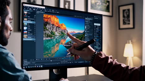 person editing photo on computer