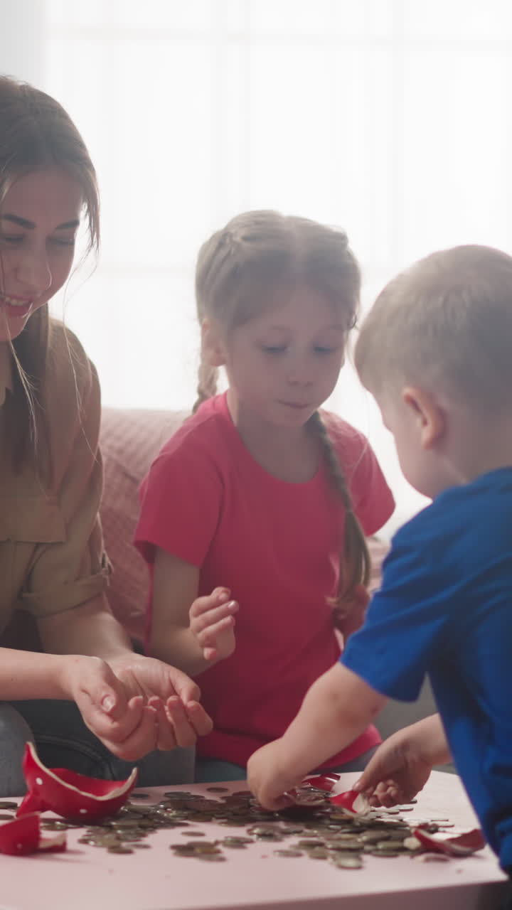young mother with children rejoice in broken piggy bank, count and collect money, small change