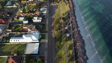 slow motion shot of holiday houses in front of ocean, esperance town, western australia