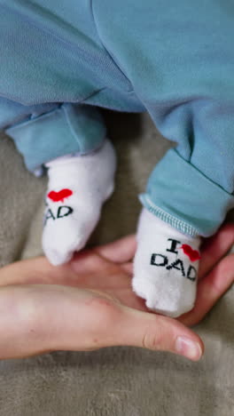 baby feet with i love dad socks