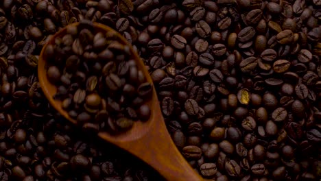 4k footage. 4096x2304p.fragrant coffee beans are roasted in a frying pan, smoke comes from coffee beans. the whole composition scrolls slowly around the camera. scoop stir coffee beans.