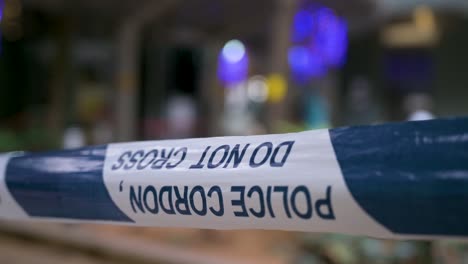 police cordon tape is seen in the foreground as a neighborhood area is under lockdown to contain the spread of the coronavirus variant outbreak in hong kong