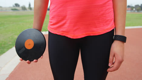 mid section of female athlete getting ready for discus throw 4k